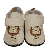 White Baby Shoes With a Cartoon Lion Appliqué
