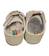 White Baby Shoes With a Cartoon Lion Appliqué