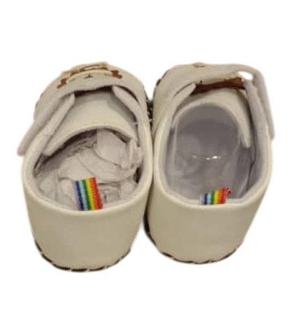 White Baby Shoes With a Cartoon Lion Appliqué